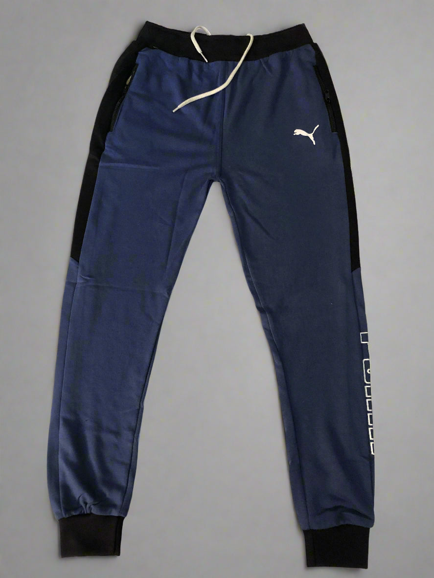 Navy blue athletic pants with a logo on a white background