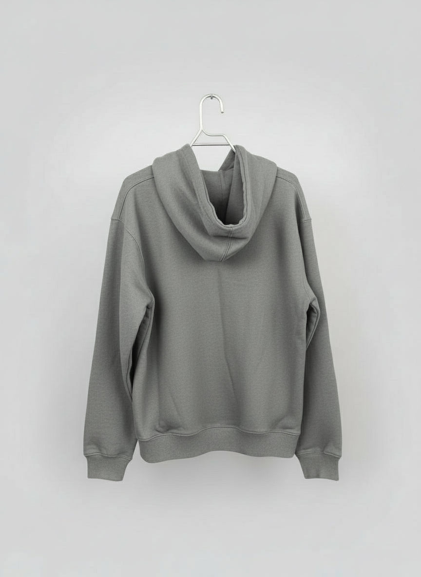 grey hoodie on a hanger against a white background