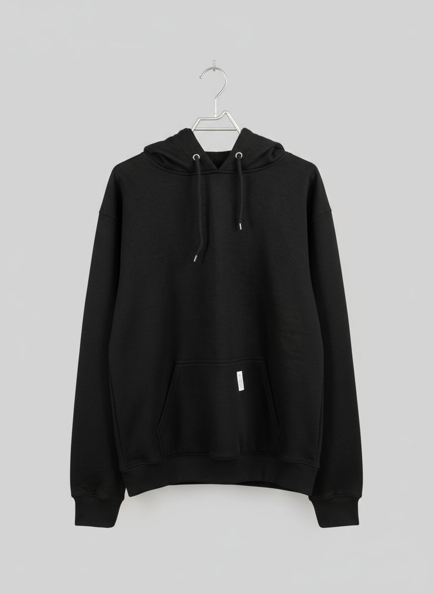 Black hoodie on a hanger with a neutral background